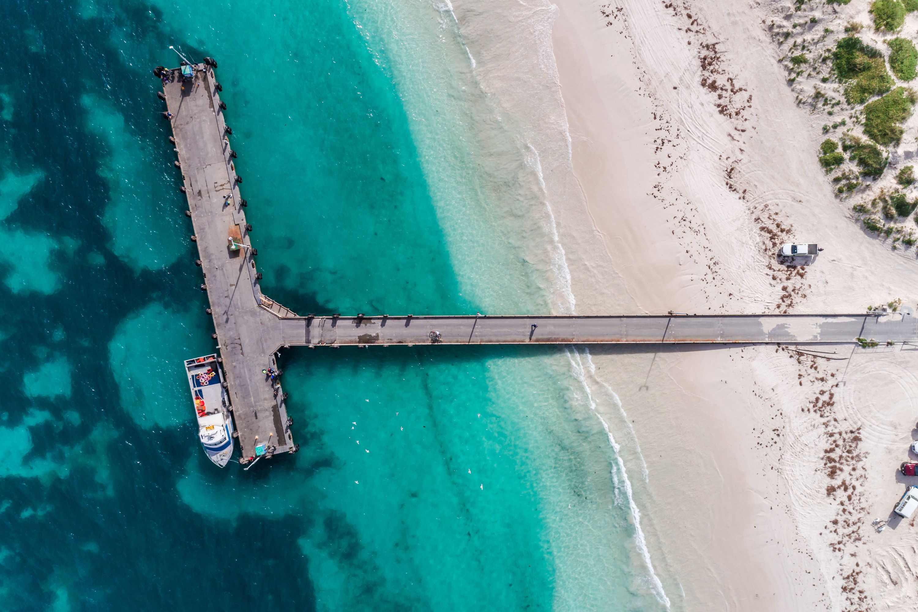 Aerial shot of pier on beach in Western Australia