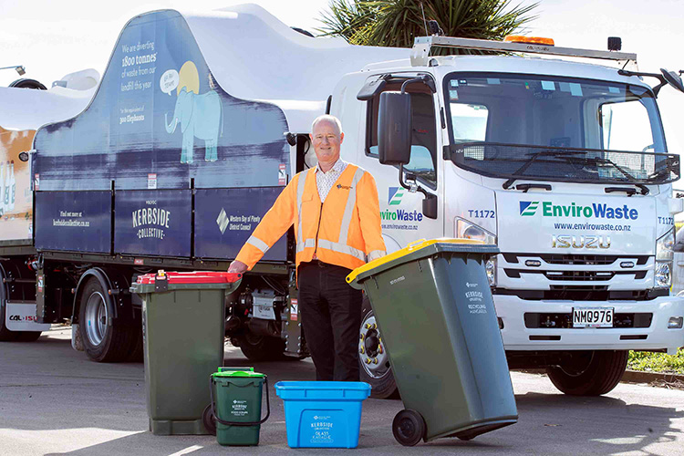 Council Deputy CEO and Group Manager Infrastructure Services, Gary Allis, in front of a garbage truck showing off four bins