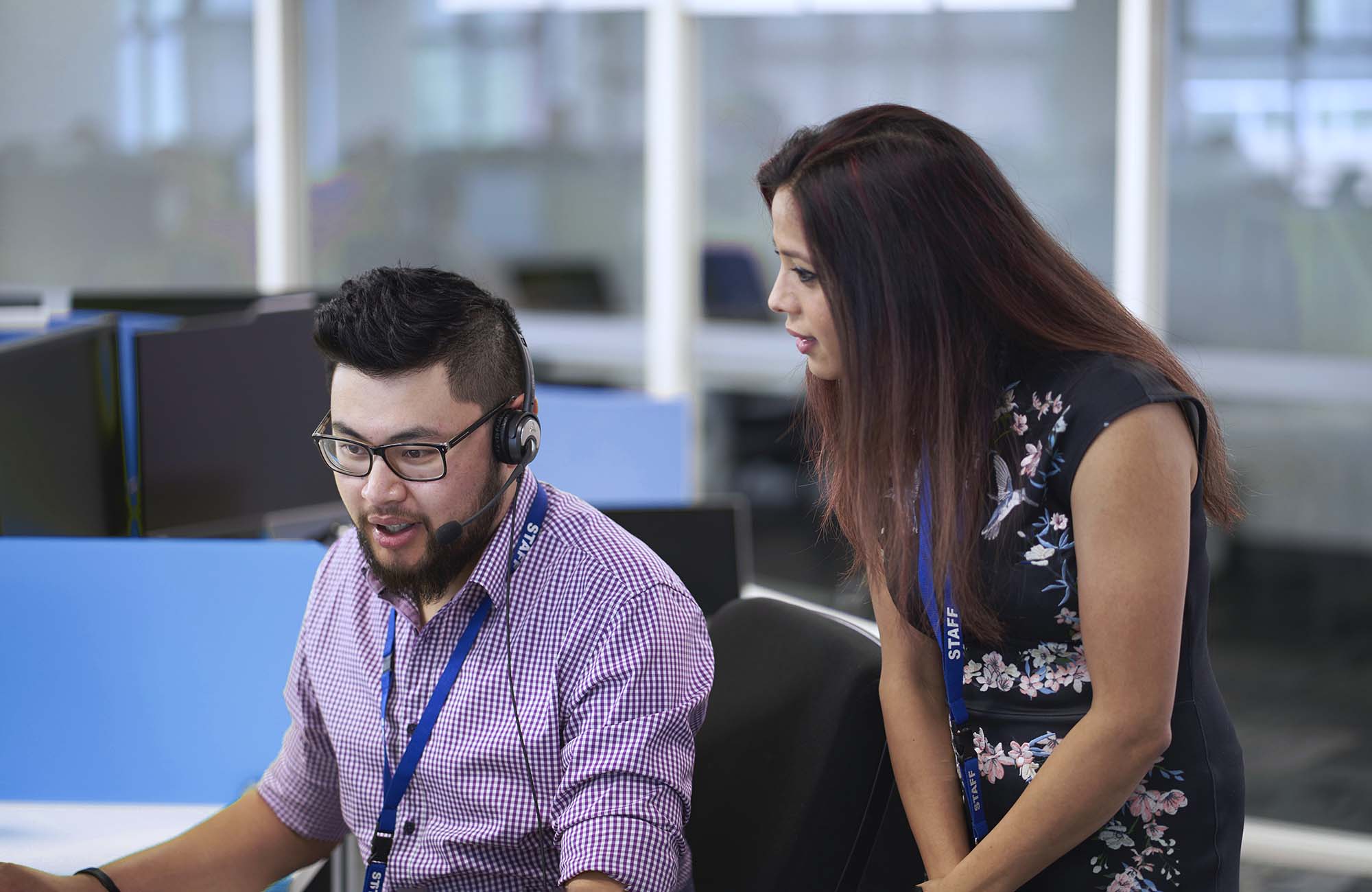 People in a call centre collaborating